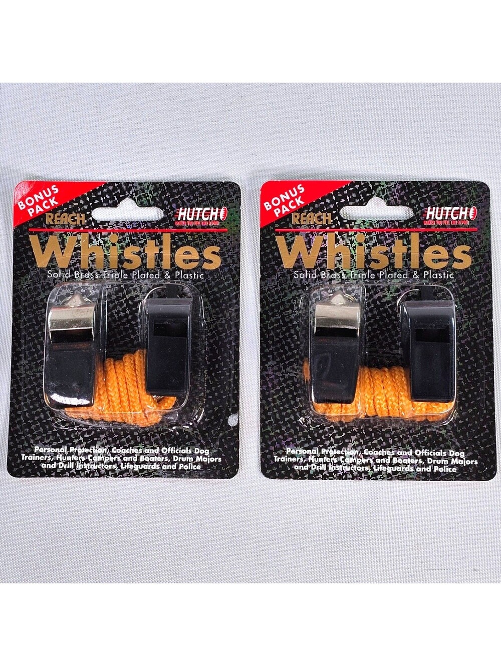 Vtg 2 Pack Hutch Reach Whistles Solid Brass Triple Plated & Plastic w/ Lanyards
